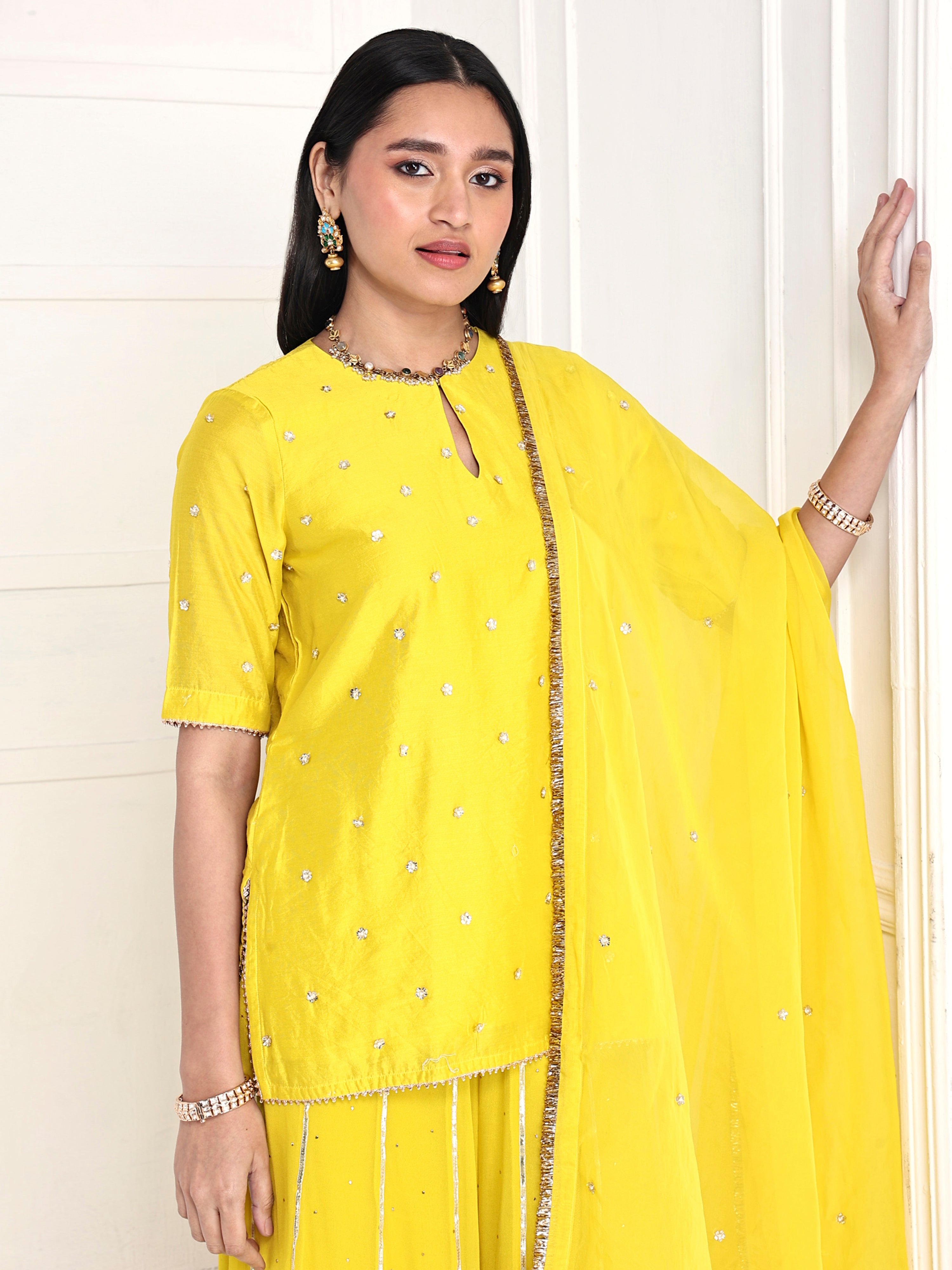 Short kurta paired with kali palazzo and dupatta