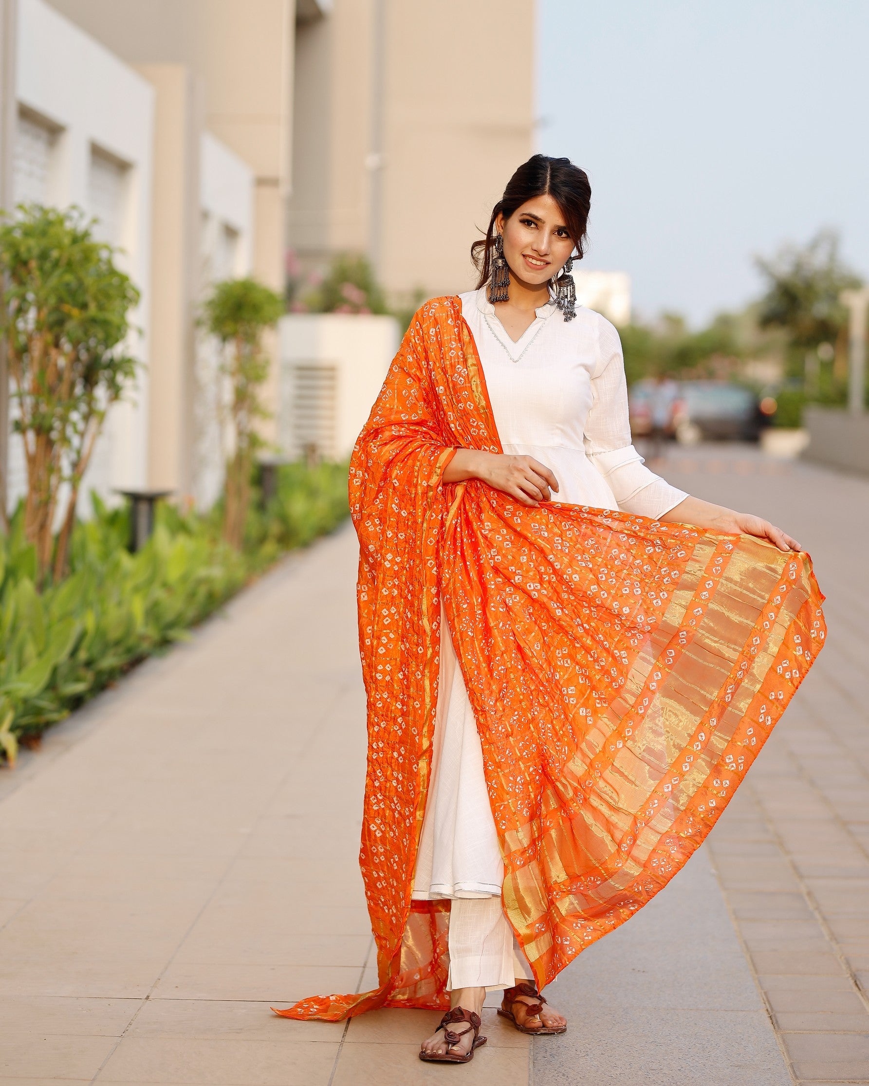 Bright white flared kurta set with bandej dupatta