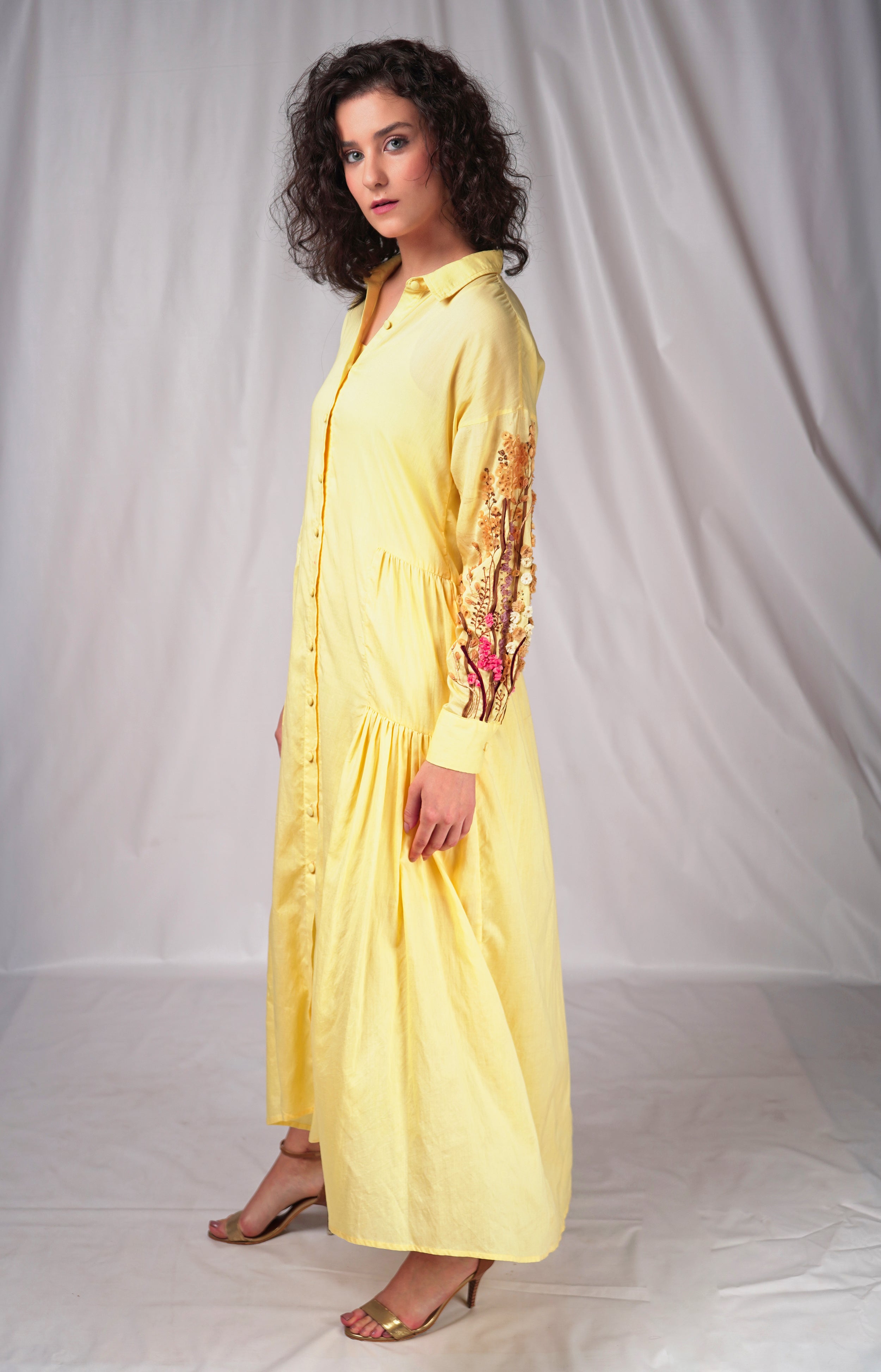 Yellow long dress with embroidery details on sleeves