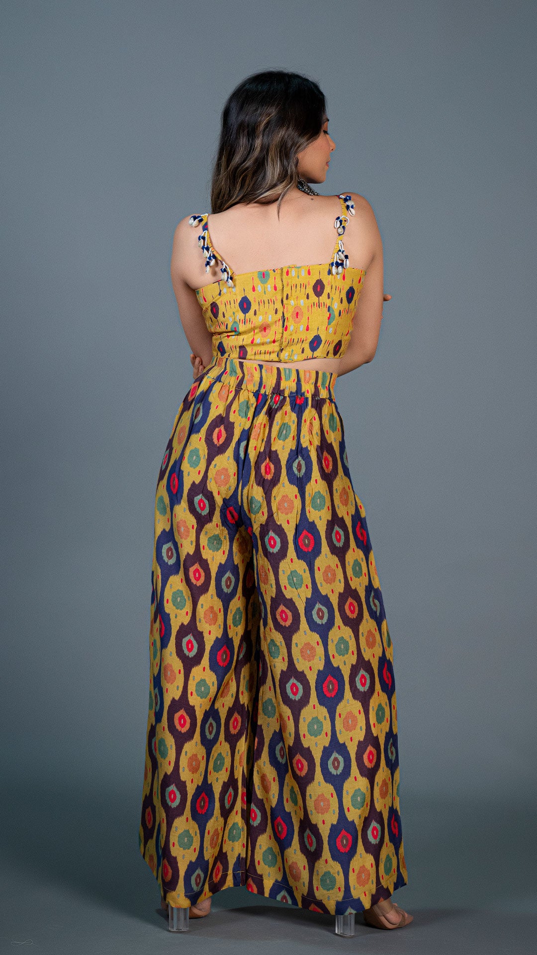 YELLOW IKKAT PRINT PLEATED PANTS IN SILK + SILK EMBELLISHED CROP TOP