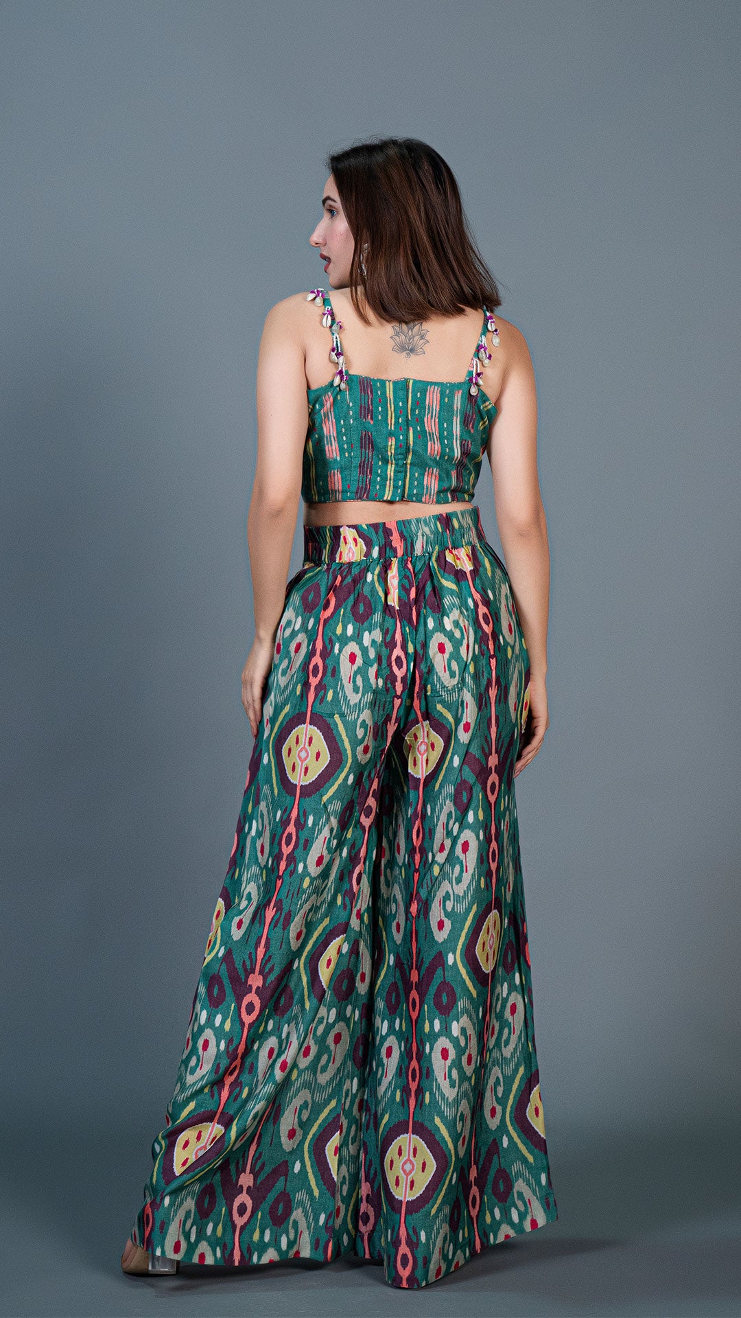 GREEN IKKAT PRINT PLEATED PANTS IN SILK + SILK EMBELLISHED CROP TOP