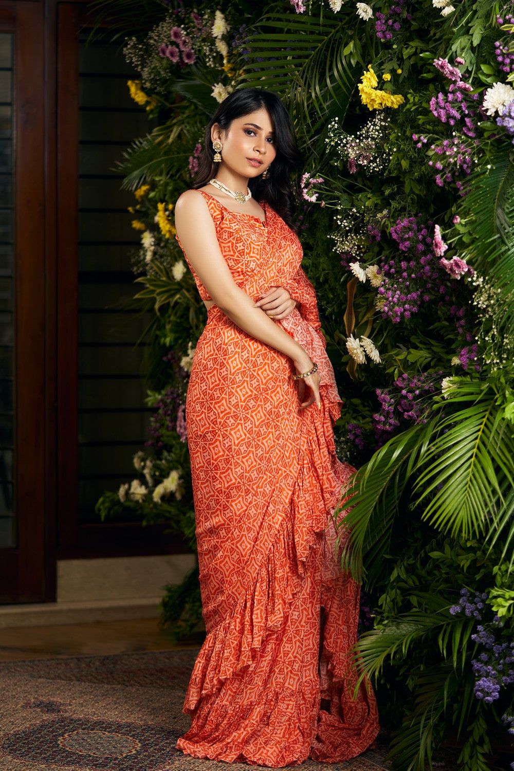 orange printed ruffle saree