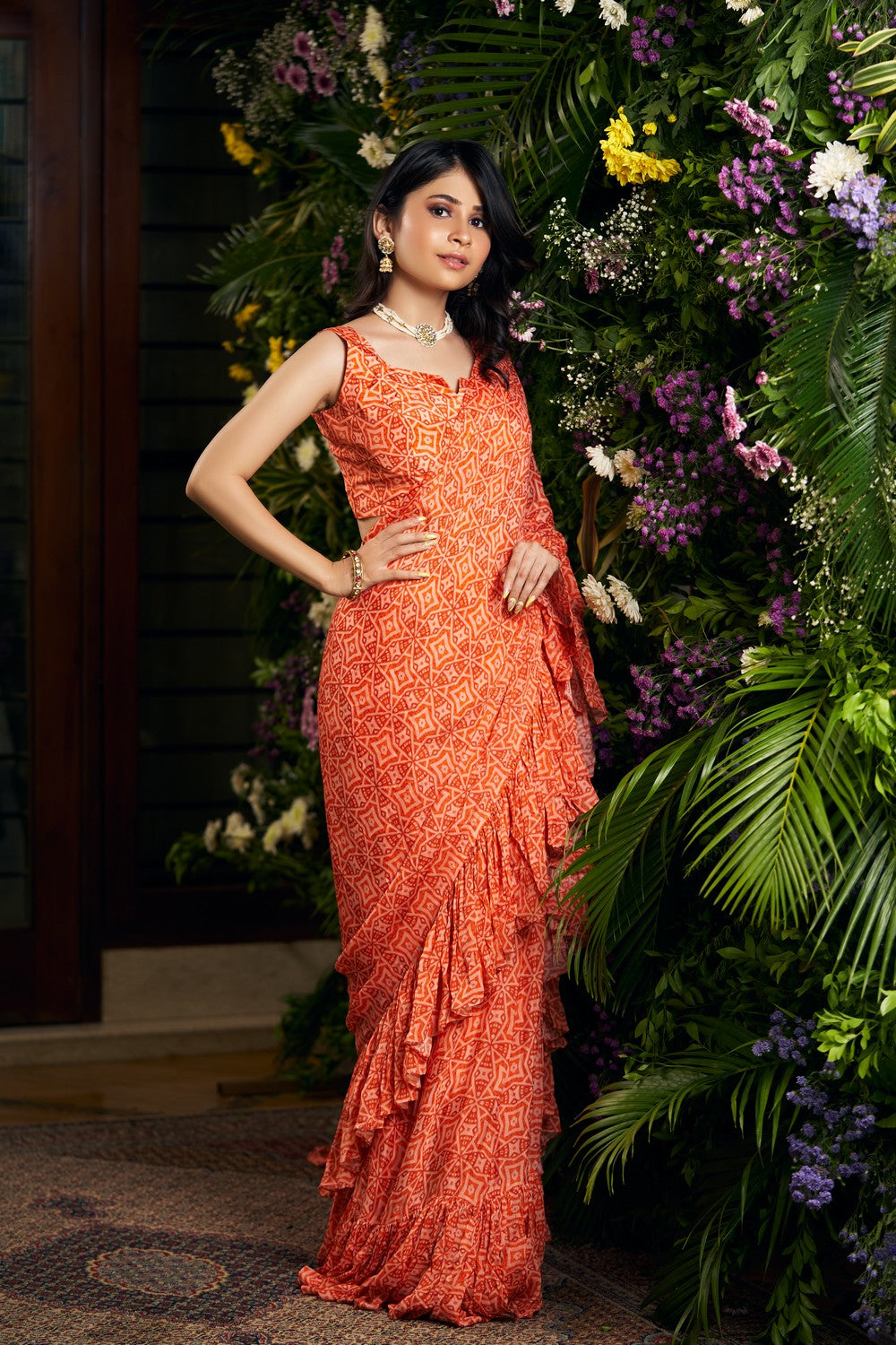 orange printed ruffle saree