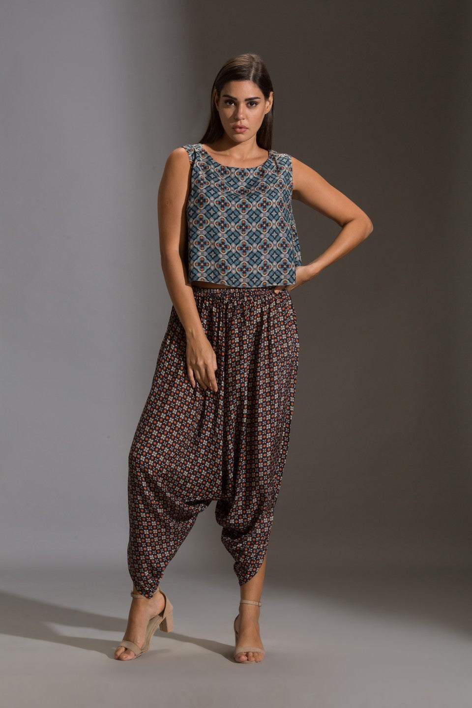 Top paired with dhoti pants and cape