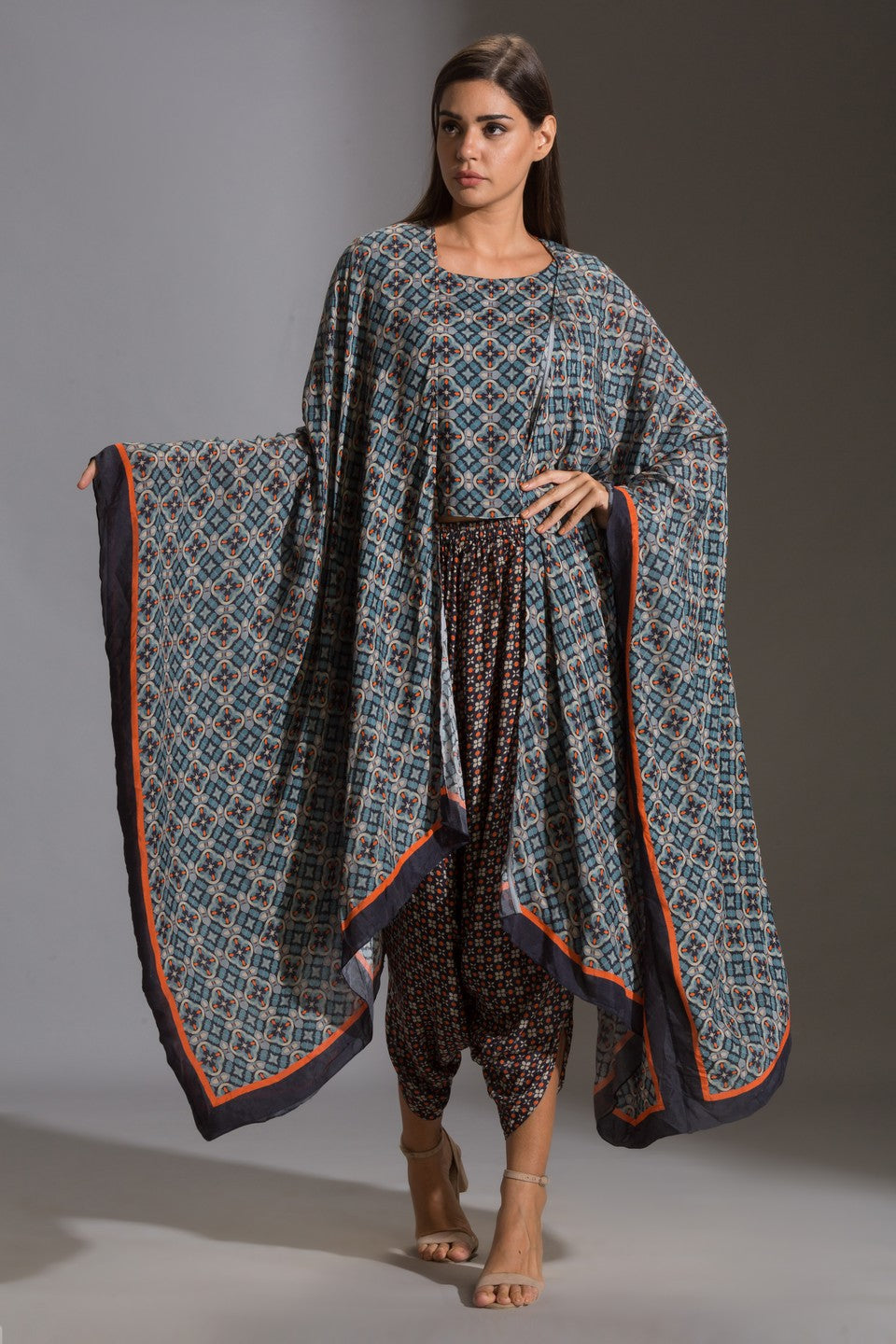 Top paired with dhoti pants and cape