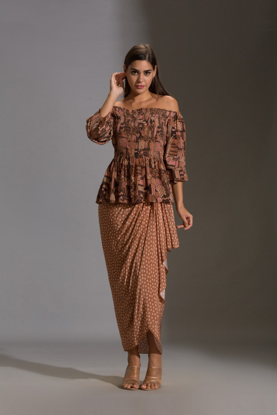 Top paired with printed dhoti skurt