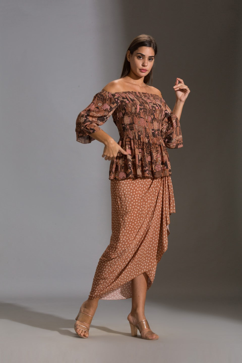 Top paired with printed dhoti skurt