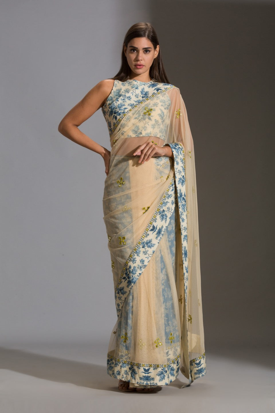 Draped net saree with incut sleeveless blouse