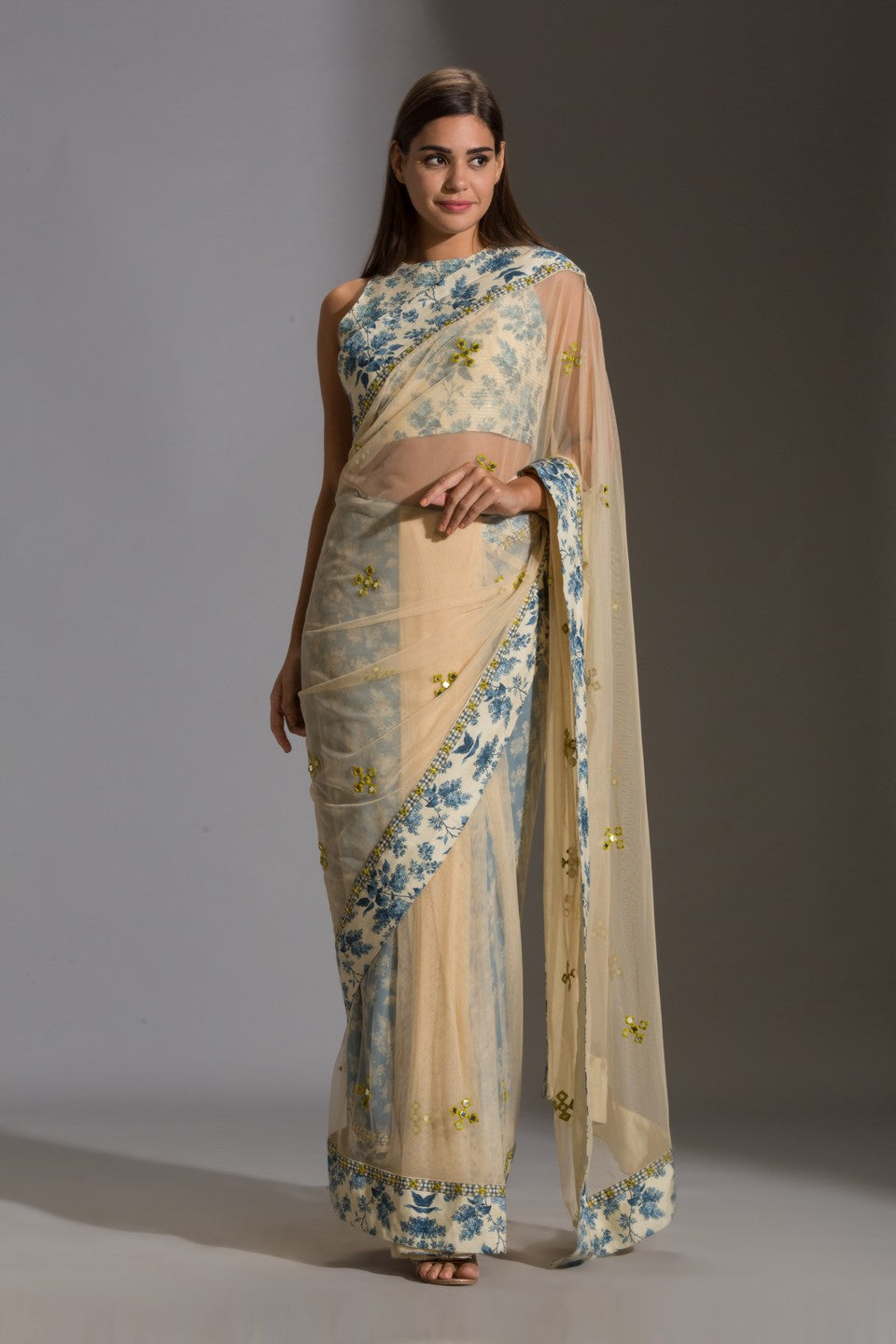 Draped net saree with incut sleeveless blouse