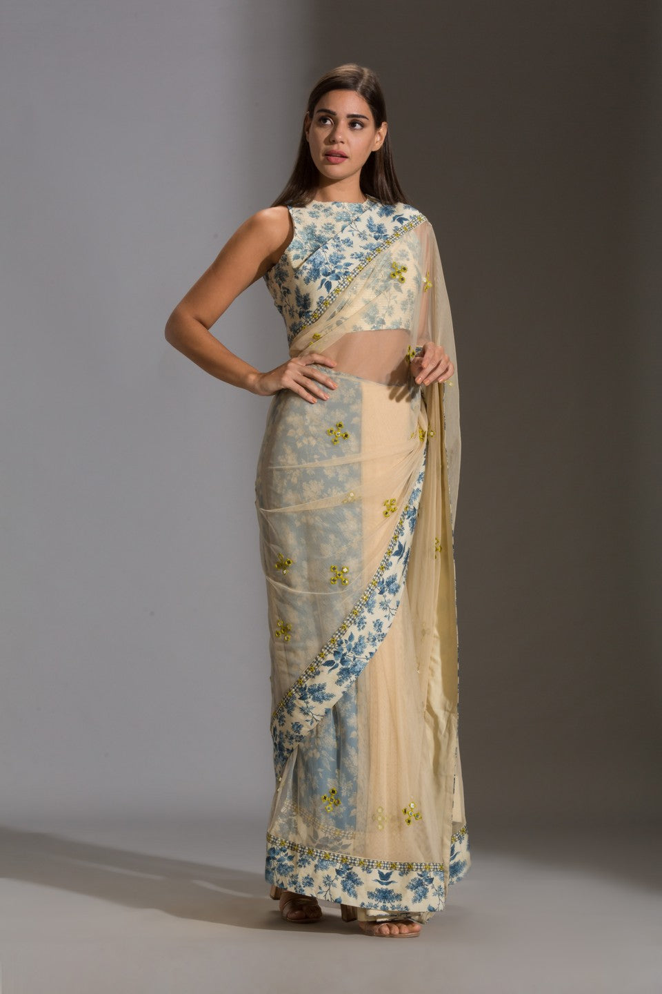 Draped net saree with incut sleeveless blouse