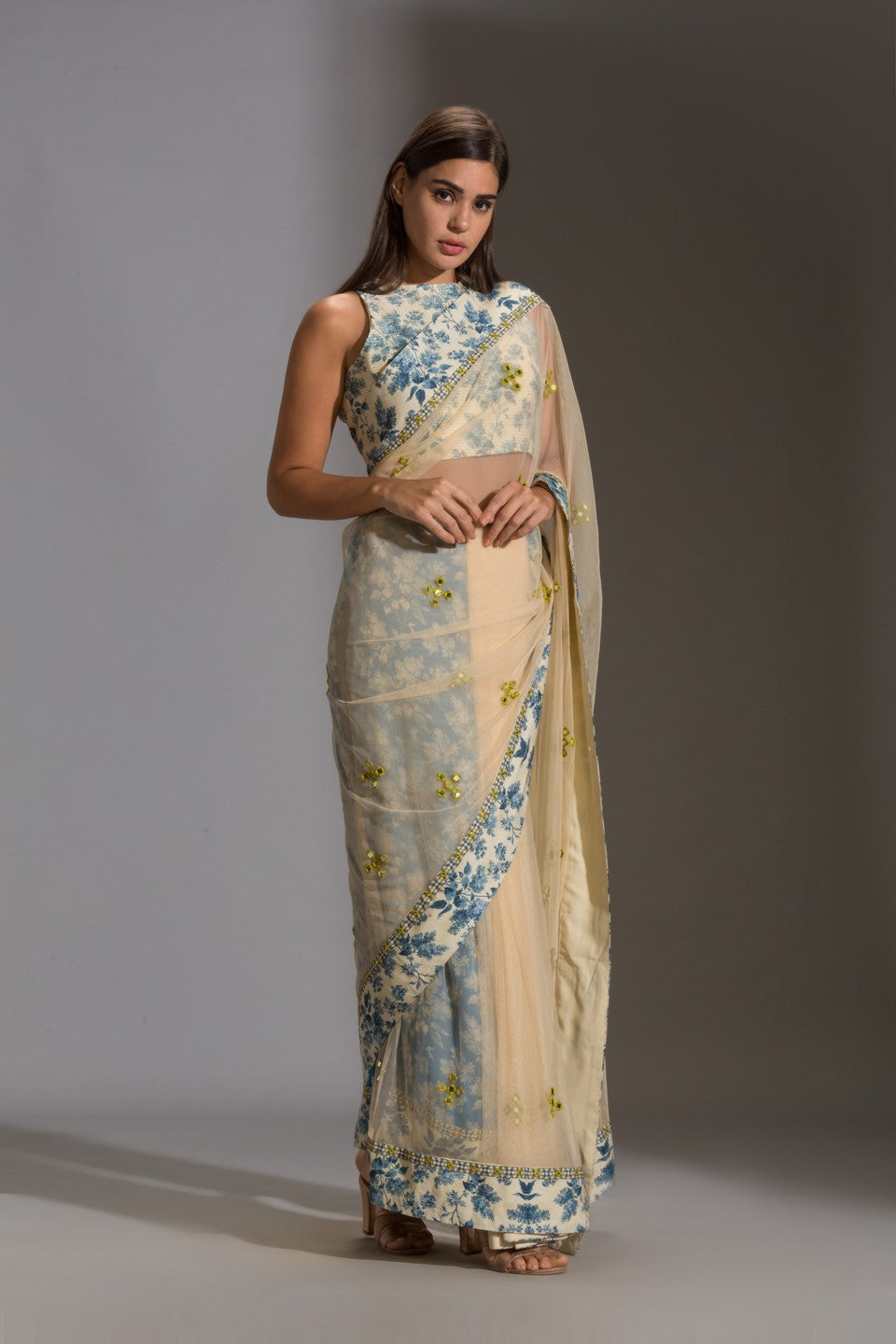 Draped net saree with incut sleeveless blouse