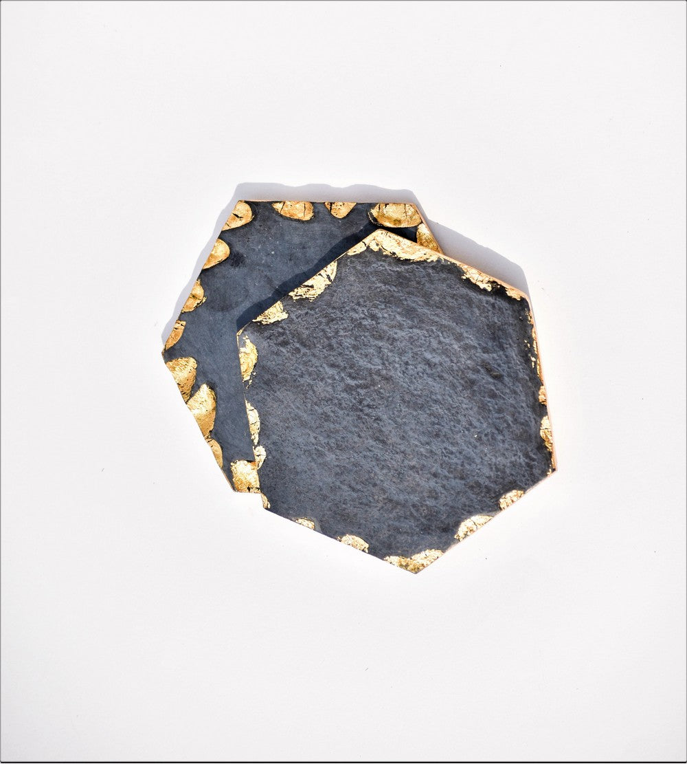 Hexagon black and gold toned marble coasters