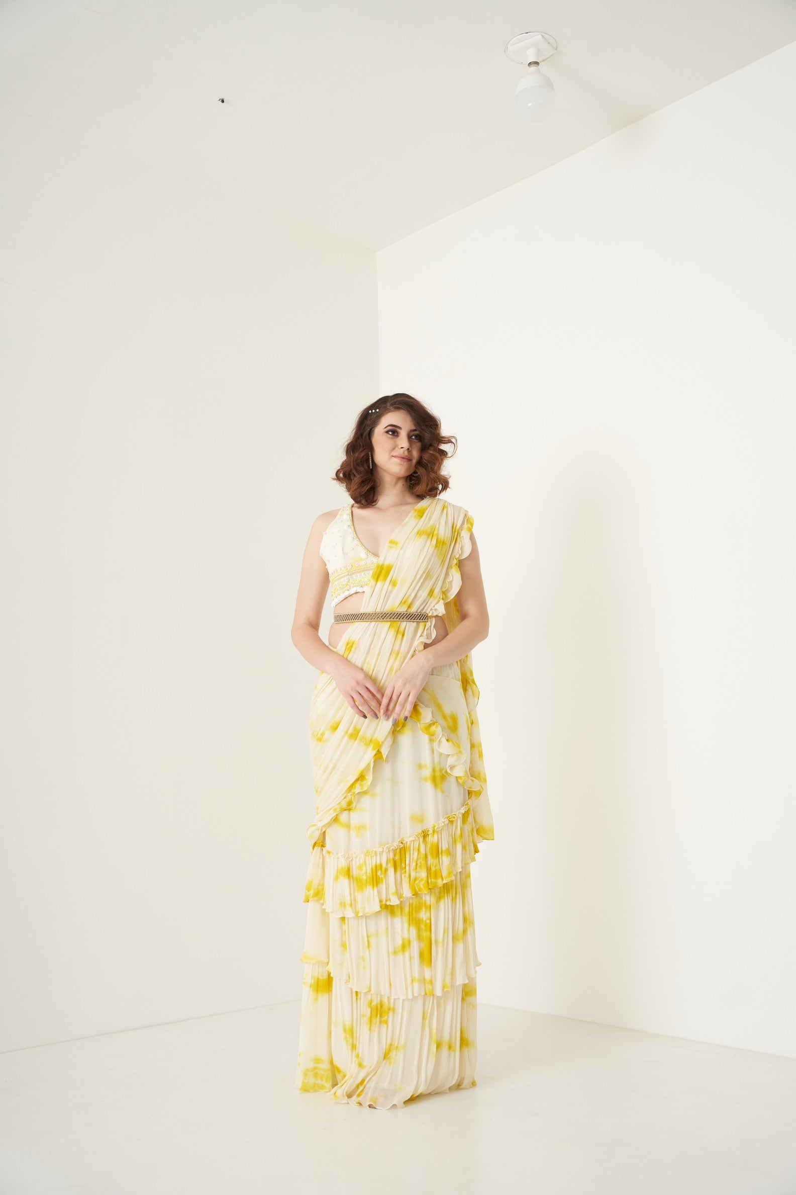 Yellow tie and dye pre drape ruffle saree