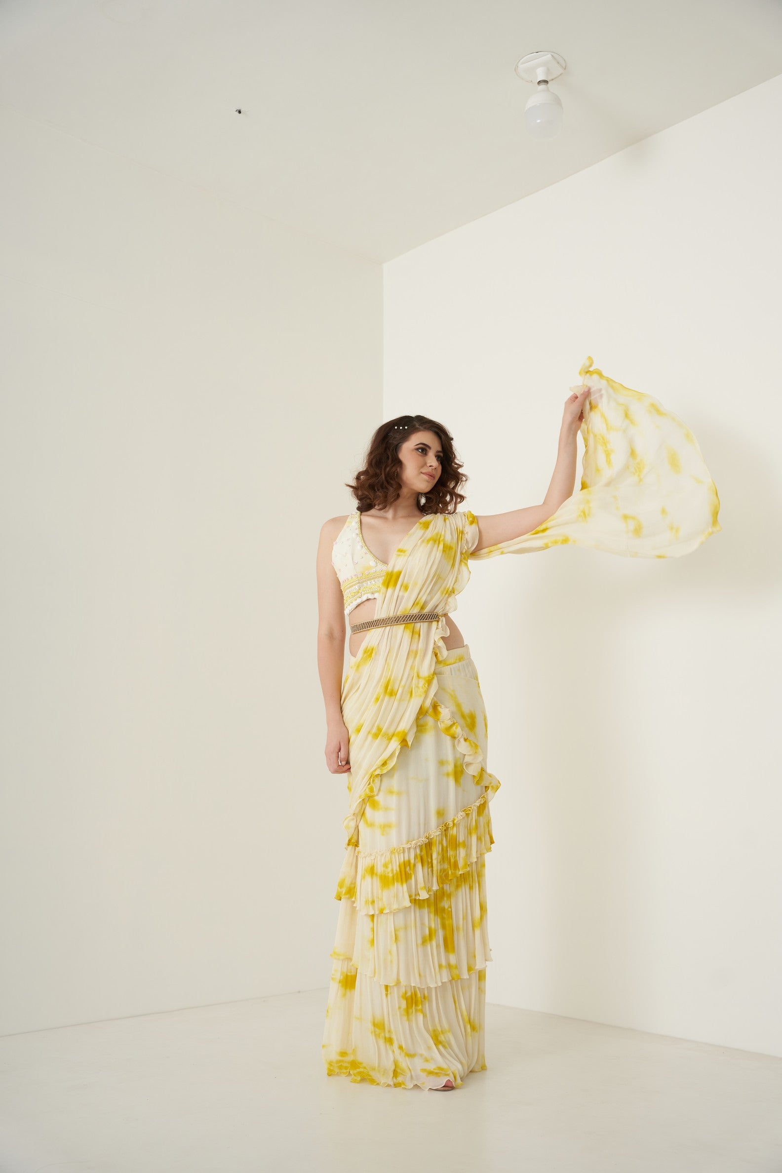 Yellow tie and dye pre drape ruffle saree